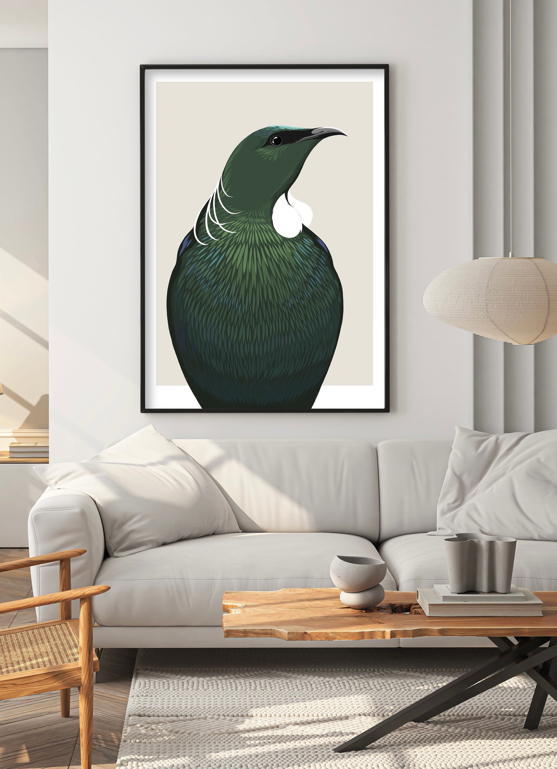 Black framed Tui art print by NZ artist Hansby Design, styled in the living room